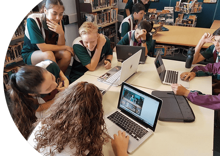 A number of school students playing some games on their laptop