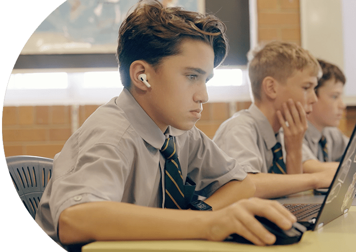 A few school students studying on their laptops